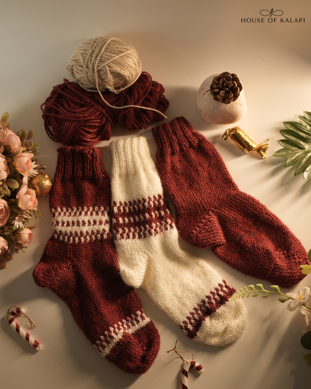 Hand-knit Christmas socks pack of 3 in cream and maroon with yarn, flowers and festive accents: House of Kalapi slow-fashion winter set.